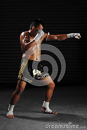 Muay Thai male fighter in actions Editorial Stock Photo