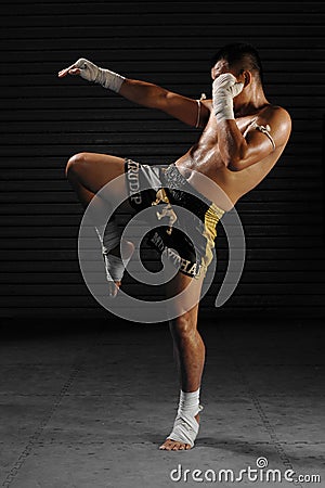 Muay Thai male fighter in actions Editorial Stock Photo
