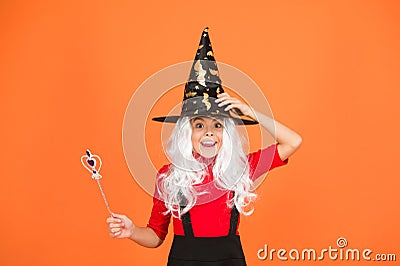 This is so much fun. small child witch hat. trick or treat. supernatural charmer. kid enchantress wave magic wand. happy Stock Photo