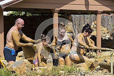 Mud baths to improve the condition of the skin and strengthen the immune system Editorial Stock Photo