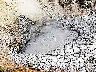 Mud Caldron and cracked earth Stock Photo
