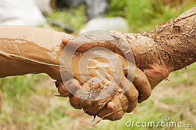 Mud handshake Stock Photo