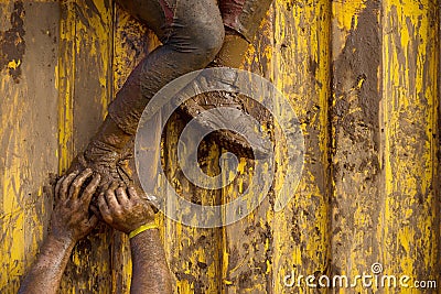 Mud race runners Stock Photo