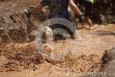 Mud race runners Stock Photo