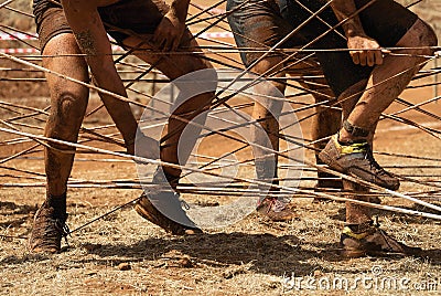 Mud race runners Stock Photo