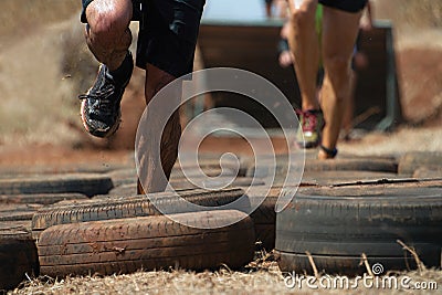 Mud race runners Stock Photo