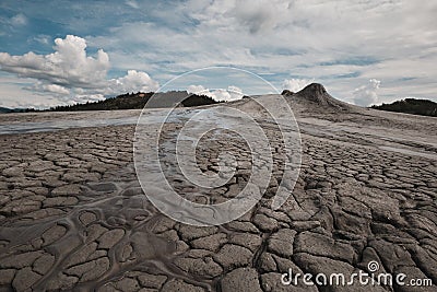 Mud volcano erupting with dirt, vulcanii Noroiosi in Buzau, Romania. Cracks, eruption. Stock Photo