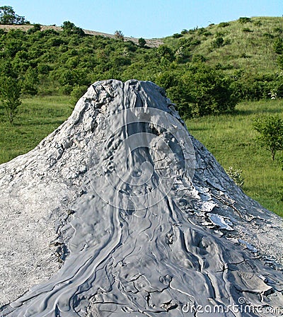 Mud volcano flowing down clayey mud mixed with hydrocarbons. Natural Reserve Salse of Nirano: Modena, Italy Stock Photo