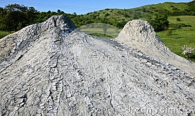 Mud volcano flowing down clayey mud Stock Photo