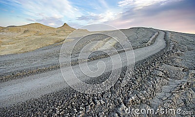 Mud volcano landscape at sunset. Bubbling mud - landmark attraction in Buzau, Romania Stock Photo