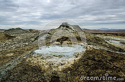 Mud volcano in the mountains. Mud volcano at national park erupt Stock Photo
