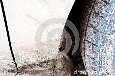 Muddy Car Wheel Arch and Tire Stock Photo