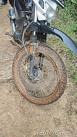 Muddy tire on a muddy land Stock Photo