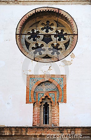 Mudejar style window with tiles -alicatados- and rose window of the church of Omnium Sanctorum in Seville, Spain Stock Photo