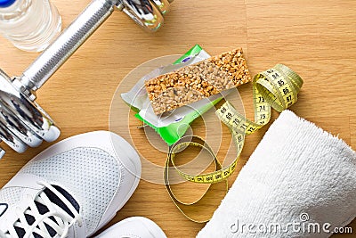 Muesli bar and sport equipment Stock Photo