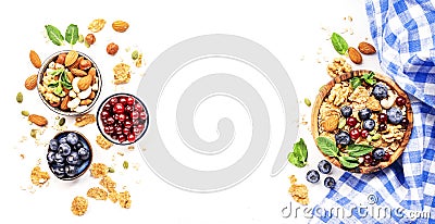 Muesli bowl and organic ingredients for healthy breakfast. Granola, nuts, blueberry, cranberry, oatmeal, greek yoghurt, whole Stock Photo
