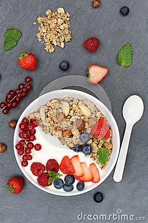 Muesli breakfast fruits yogurt strawberries cereals berries bowl Stock Photo