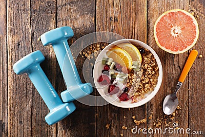 Muesli, dairy and fruit- dumbbell- fitness food concept Stock Photo