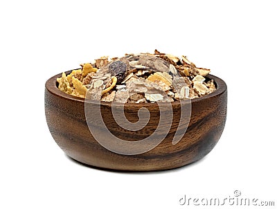 Muesli multi fruit in wooden bowl isolated on white background Stock Photo