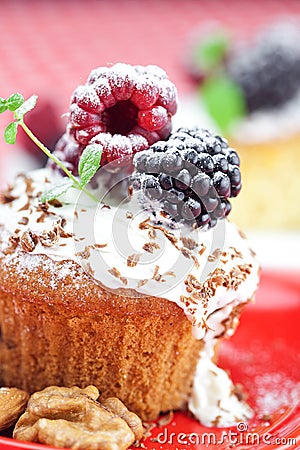 Muffin with whipped cream and cake with icing Stock Photo