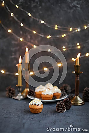 Muffins with butter cream in a vintage plate. New Year`s festive desserts Stock Photo