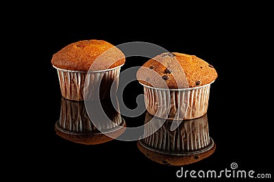 Muffins with chocolate drops, wrapped in paper Stock Photo