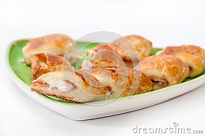 Muffins with ham and cheese on the green plate Stock Photo