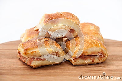 Muffins with ham and cheese on the kitchen wooden board Stock Photo