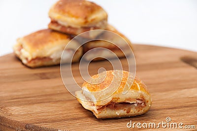 Muffins with ham and cheese on the kitchen wooden board Stock Photo