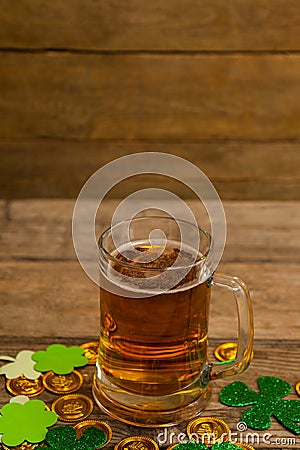 Mug of beer, chocolate gold coins and shamrock for St Patricks Day Stock Photo