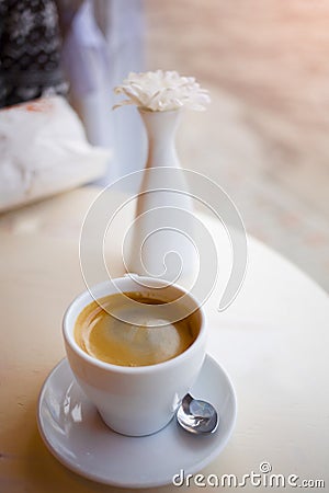 Mug with coffee stand on the table. Stock Photo