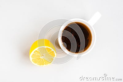 Mug of hot tea with lemon on gray background. Catarrhal disease. Flu season Stock Photo