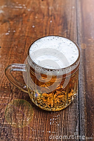 Mug, lager, beer, foam, wooden table, pub, Oktoberfest, German b Stock Photo