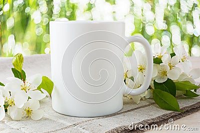 Mug mockup with apple blossom Stock Photo