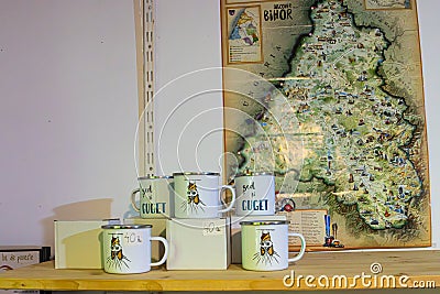 Mugs for sale at the gift shop at the Meziad Cave. One of the most beautiful caves in Romania Editorial Stock Photo
