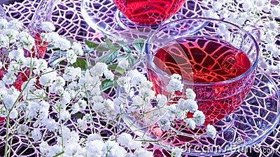 Mugs of red tea on a pink rainbow background with gypsophila flowers. Zen tea ceremony. Photo of red herbal Indian healing tea. Stock Photo
