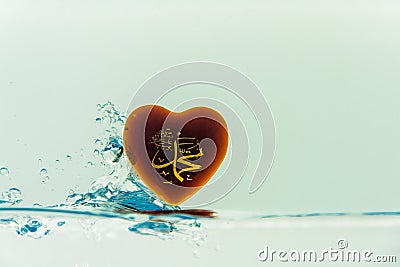 `muhammad ` prophet of Islam symbol Water splash with bubbles of air, on the white background Stock Photo