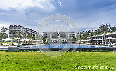 Muine Bay Resort with beautiful sea view with palm trees, sky, resort. Location in Mui Ne, Phan Thiet city, Binh Thuan province, Editorial Stock Photo