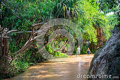 Muine, Vietnam - July 18, 2019 - Fairy Stream. River, Red Canyon. Children running around playing on the river Editorial Stock Photo