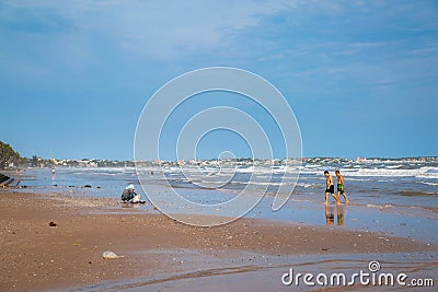 Muine, Vietnam - July 18, 2019 - South China sea. People swim in the sea Editorial Stock Photo