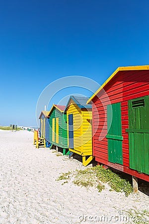 Muizenberg beach with white sand and colorful wooden cabins in Cape Town Stock Photo