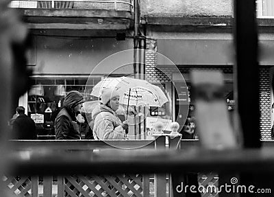 Mukachevo city, Ukraine, 2023. Woman holding an umbrella Editorial Stock Photo