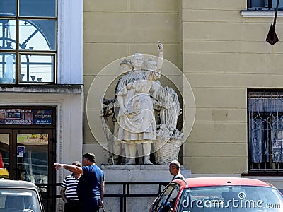 Sculpture of a peasant woman near the entrance to the building of the train station Mukachevo Editorial Stock Photo