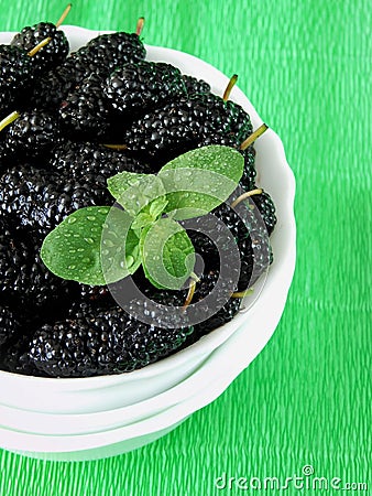 Mulberries on a bright colourful background Stock Photo