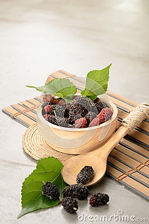 Mulberry fruit leaf food closeup natural wooden vertical view Stock Photo