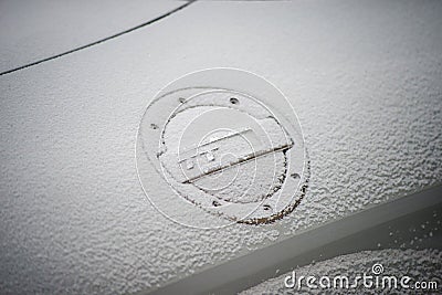 Audi TT logo on tank trap on the white car covered by the snow by snowy day Editorial Stock Photo