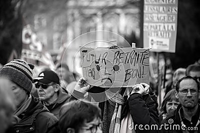 people protesting in the street with placard in french : futur retraite tiens bon, in Editorial Stock Photo
