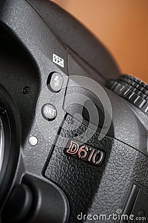 Nikon D610 reflex Full Frame on brown background Editorial Stock Photo
