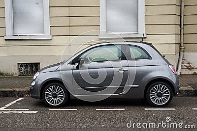 Profile view of Gray Fiat 500 car, the famous italian brand of cars parked in the street Editorial Stock Photo