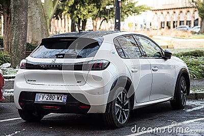 Rear view of white Peugeot e208 parked in the street, Peugeot is the famous french brand of cars of the psa group Editorial Stock Photo